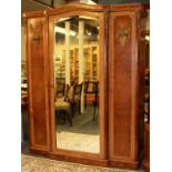 A 19th Century French ormolu mounted and Birdseye maple veneered wardrobe, W. 165cm, H. 209cm.