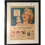 Marilyn Monroe interest. A framed Marilyn Monroe magazine advertisement, 39 x 49cm.