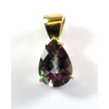 A 9ct yellow gold pendant set with a pear cut mystic topaz