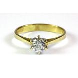 A 9ct yellow gold stone set solitaire ring, (P).
