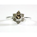 A 9ct white gold diamond set cluster ring, (K.5).