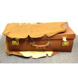 A good quality vintage leather travelling case and protective canvas cover, 66 x 36 x 19cm.