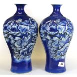 An interesting pair of early-mid 20th Century Chinese relief decorated porcelain vases, H. 33cm.