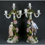 A pair of large 19th Century German porcelain figural candelabra, H. 53cm.