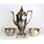 A three piece sterling silver coffee set and sugar tongs with ivory insulators, H. 23cm.