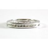 A 9ct white gold diamond set half eternity ring with "I LOVE YOU" pierced on the shank, (M).