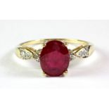 A 9ct yellow gold ruby and diamond set ring, (N.5).