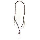 A superb string of Tibetan rock crystal prayer beads, folded length with dropper L. 125cm.