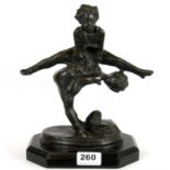 A bronze figure of two children playing leap frog after Barrie, on a wooden plinth, H. 25cm.