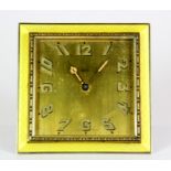 An enamelled white metal and brass bedside clock, 8 x 8cm.