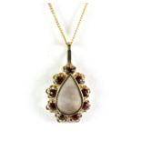 A 9ct yellow gold garnet set pendant and chain.