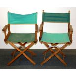 A pair of folding director's chairs.