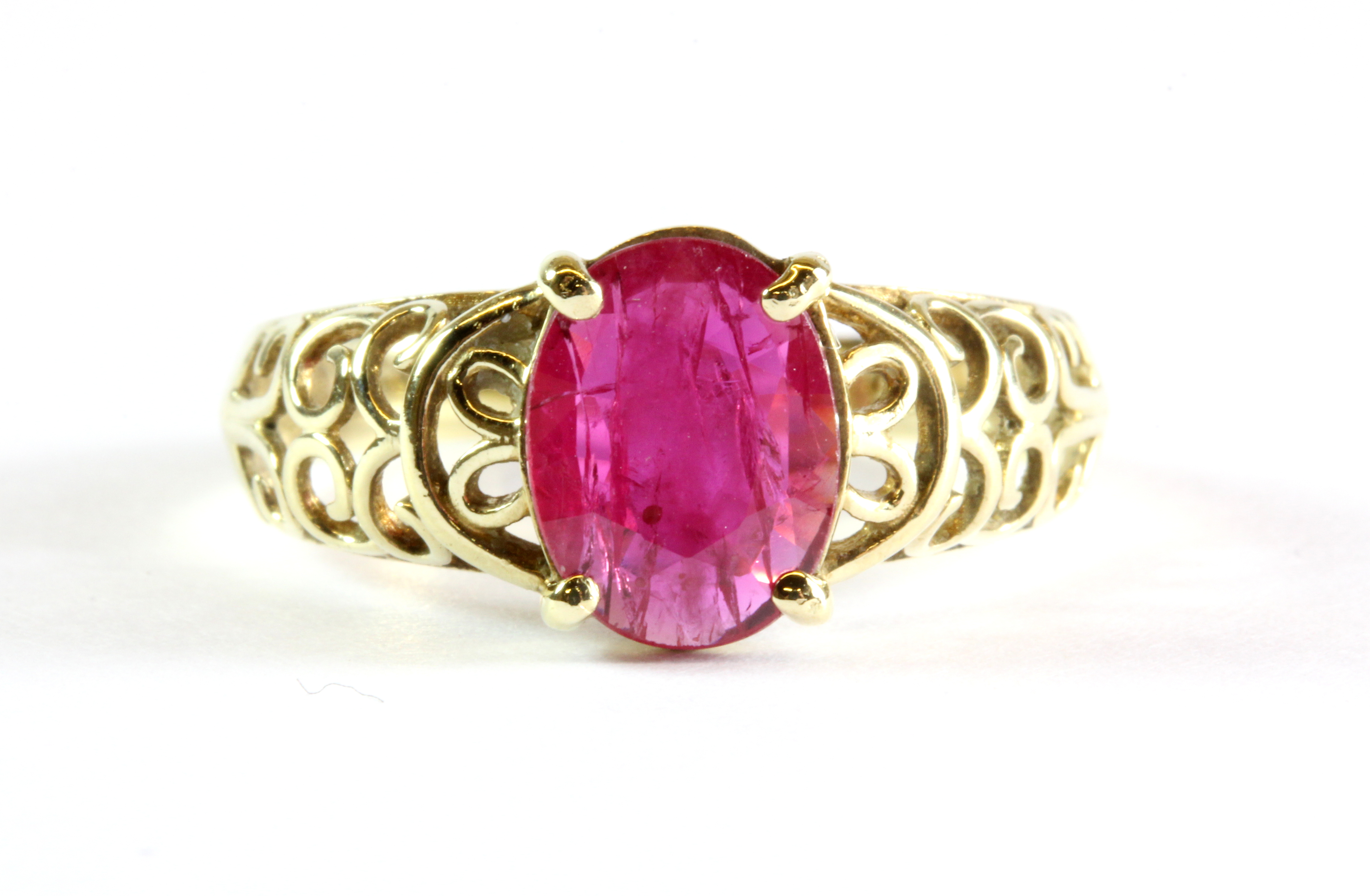 A 9ct yellow gold ring set with a 1.3ct oval cut ruby, (P.5).