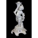 A 19th Century white porcelain oil lamp base of a cherub, H. 34cm.