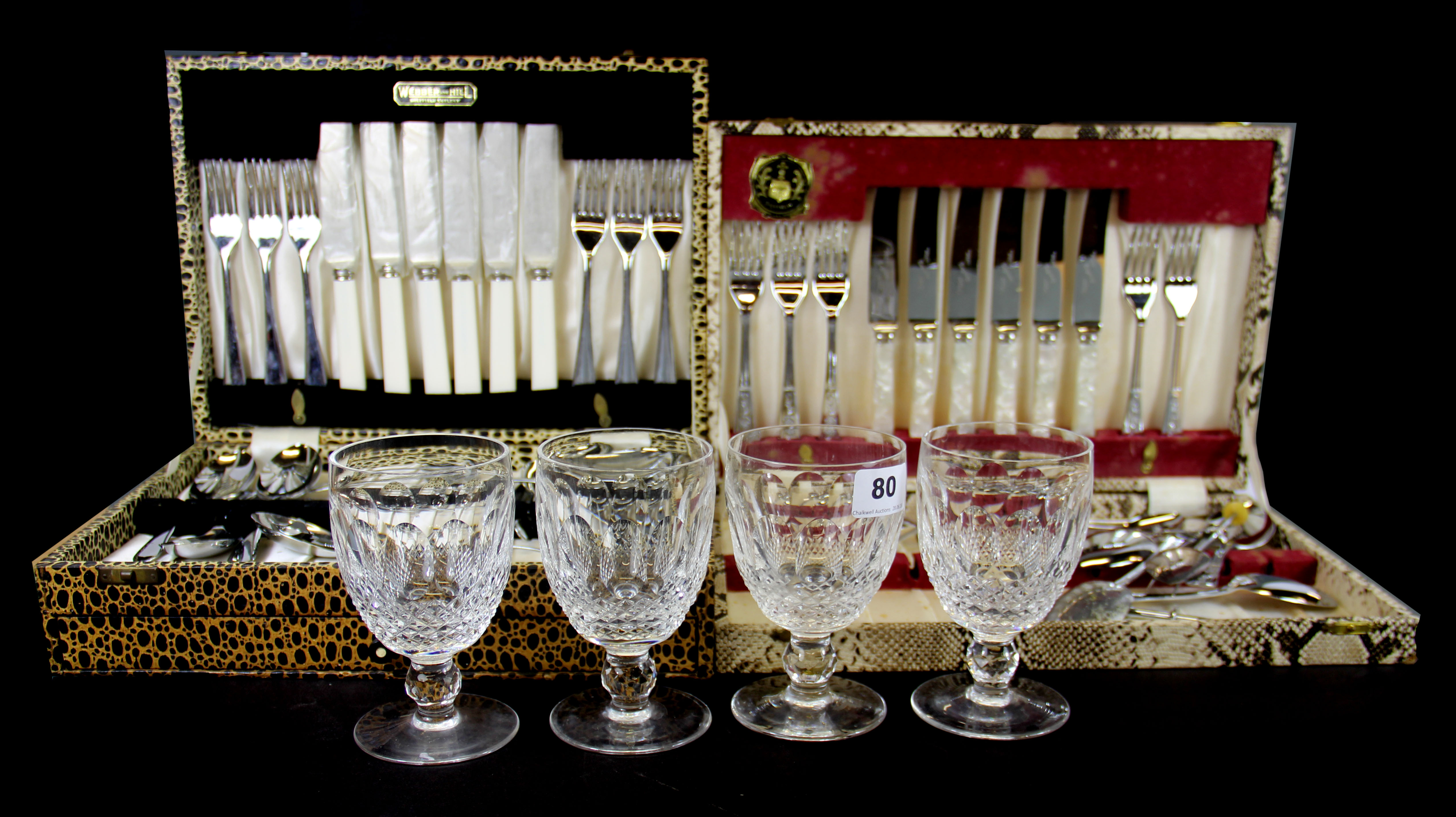 Two 1960's cases of cutlery and four cut glass Waterford wine goblets.