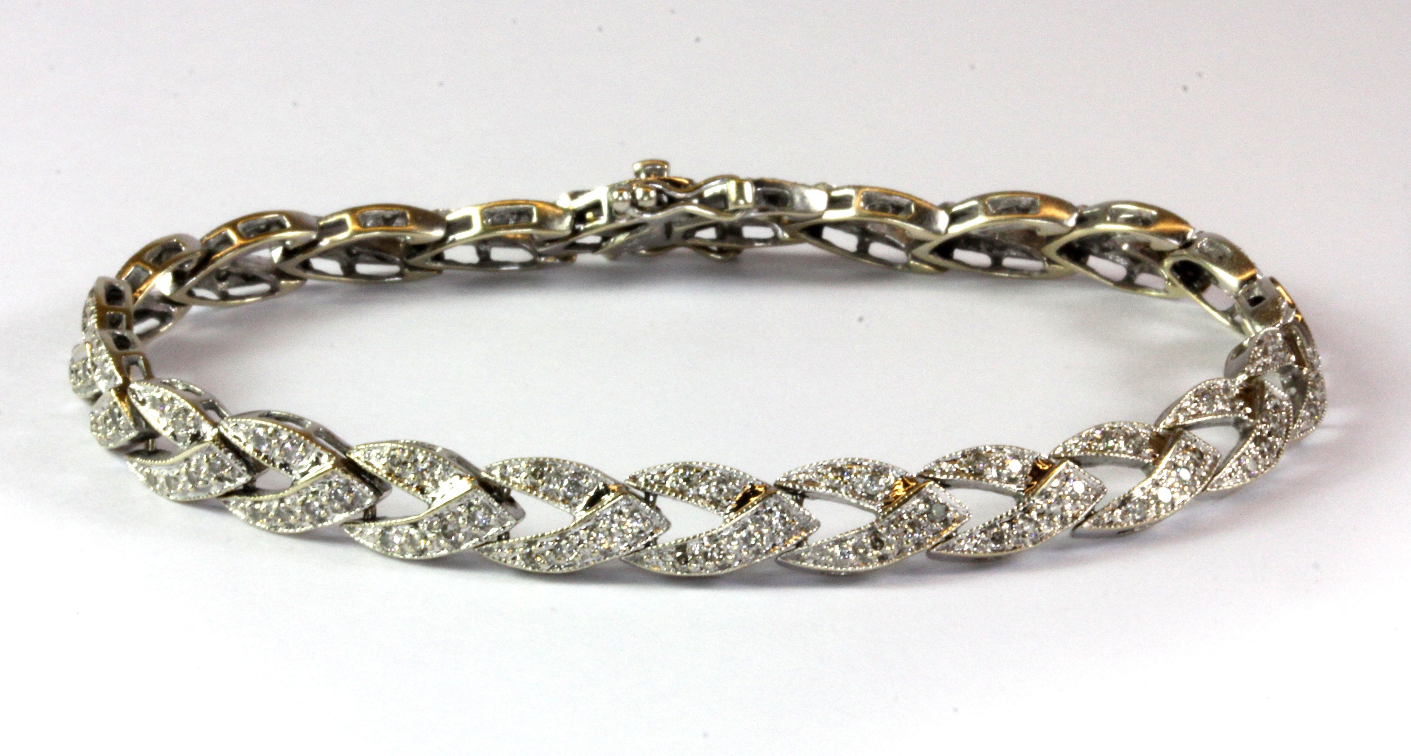 An 18ct white gold (stamped 18k) diamond set bracelet.