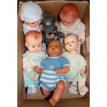 Five vintage dolls.