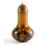 An unusual two layer Peking glass snuff bottle simulating tortoise shell with a gilt metal and