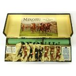A boxed vintage Minoru race game with eight cast metal horses.