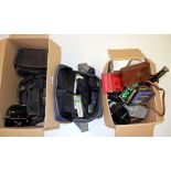 A quantity of photographic equipment and lenses.