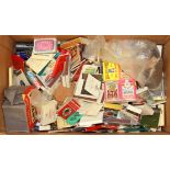 A collection of match boxes and matchbooks.