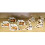 Eight porcelain figures of bathing belles, H. 8cm.