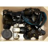 A box of cameras including Canon, Nikon etc.