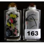 Two Chinese signed and inside painted lead crystal snuff bottles, H. 8cm. Prov. Penny collection,