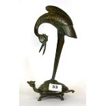 An early 20th Century Chinese bronze figure of a crane riding on the back of a mythical tortoise, H.