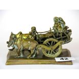 A 19th Century Indian brass model of a bullock cart, L. 13cm, H. 8cm.