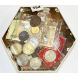 A tin of mixed coins.