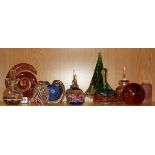 A quantity of glass paperweights and perfume bottles.