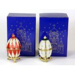 Two boxed enamelled Russian egg shaped boxes, H. 7cm.