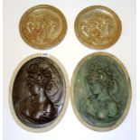 Four classical relief plaques, largest 39cm.