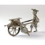 A Chinese hallmarked silver model of a street vendor, L. 6cm.