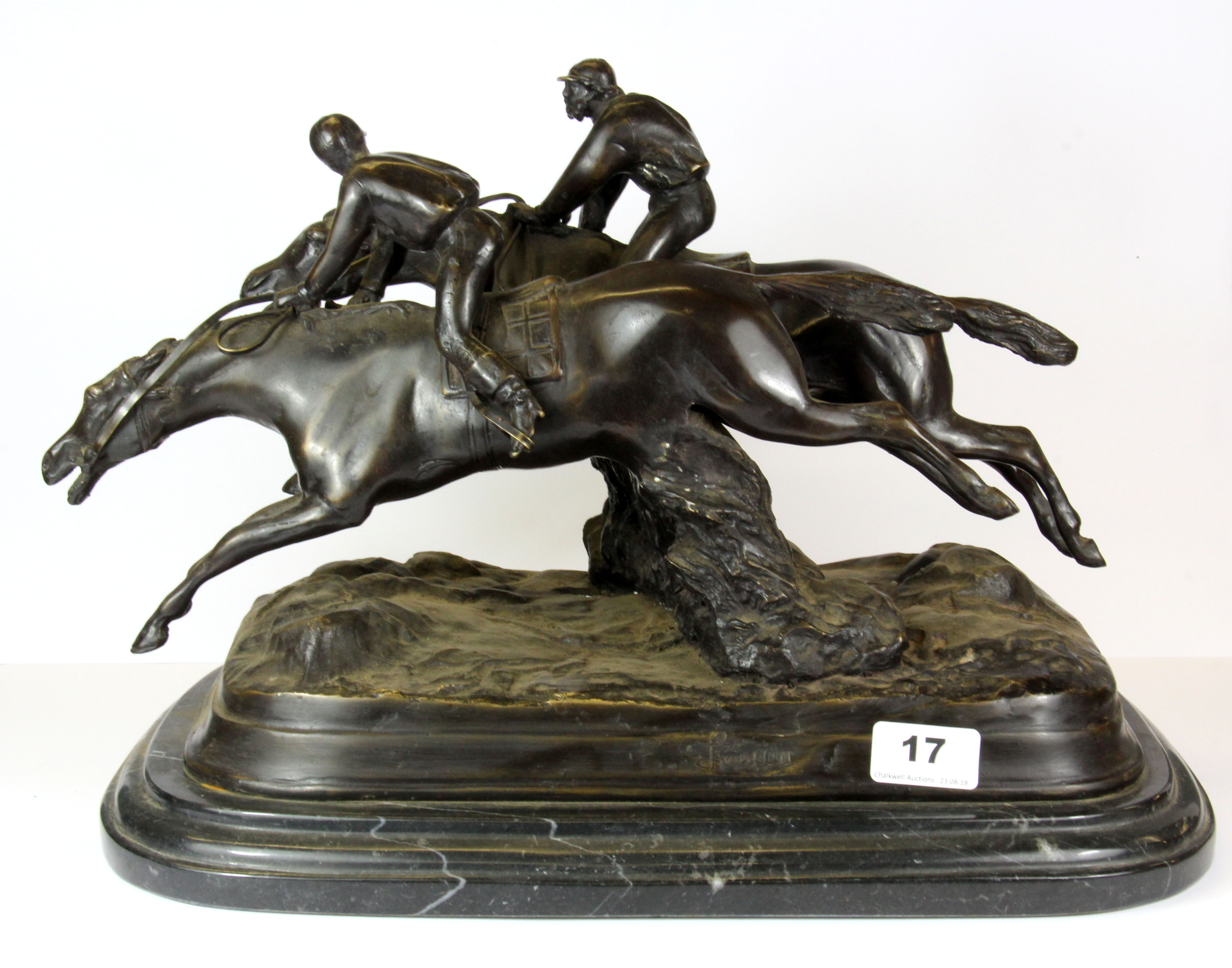 A large bronze figure of two racehorses on a black and grey marble base, L. 43cm, H. 32cm.