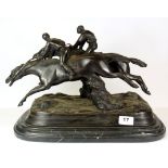 A large bronze figure of two racehorses on a black and grey marble base, L. 43cm, H. 32cm.