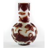 A Chinese two colour carved Peking cameo glass snuff bottle decorated with cranes, H. 7cm. Prov.