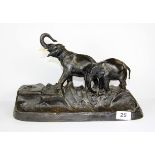 A fine Vienna bronze desk stand with inkwell mounted with elephants and signed Titze 1912, W.