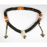 An impressive strand of Tibetan prayer beads, folded L. 40cm, bead Dia. 3cm.