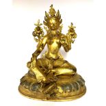 A Tibetan gilt bronze figure of a seated Tara, H. 26.5cm.