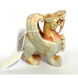 A very fine late 19th/ early 20th Century Chinese mixed colour jade figure of a dragon, H. 10cm.