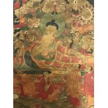 A Tibetan hand painted thangka on fine canvas with gilt highlights. 43 x 65cms