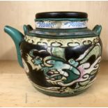 An early 20thC Chinese hand enamelled terracotta teapot. H.13cms