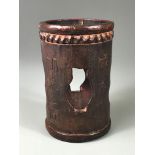 A 19th Century Chinese open carved bamboo brush pot with hardwood base, H. 13cm.