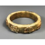 A very fine carved nephrite jade bangle decorated in relief with characters, internal Dia. 6.3cm, W.