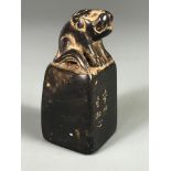 An early 20th Century Chinese black soapstone seal, H. 7cm.