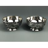 A pair of contemporary silvered metal bowls decorated with dragons and phoenix, Dia. 9.5cm.