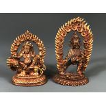 Two Tibetan miniature gilt copper bronze figures of deities with detachable flame surrounds, tallest