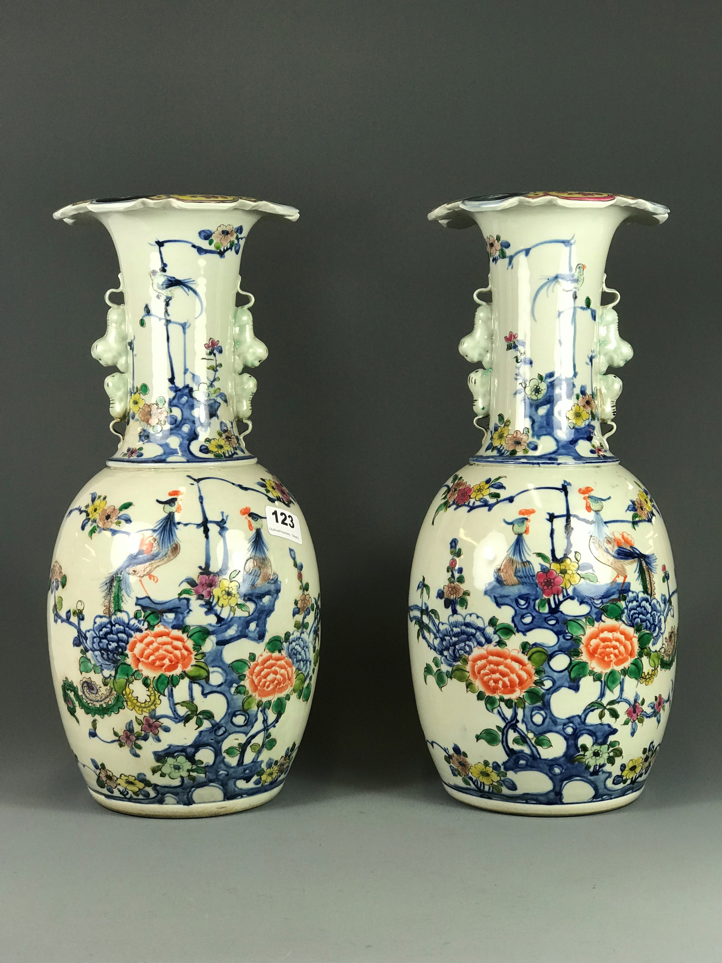 A pair of 19/20th Century hand painted porcelain vases, H. 42cm.